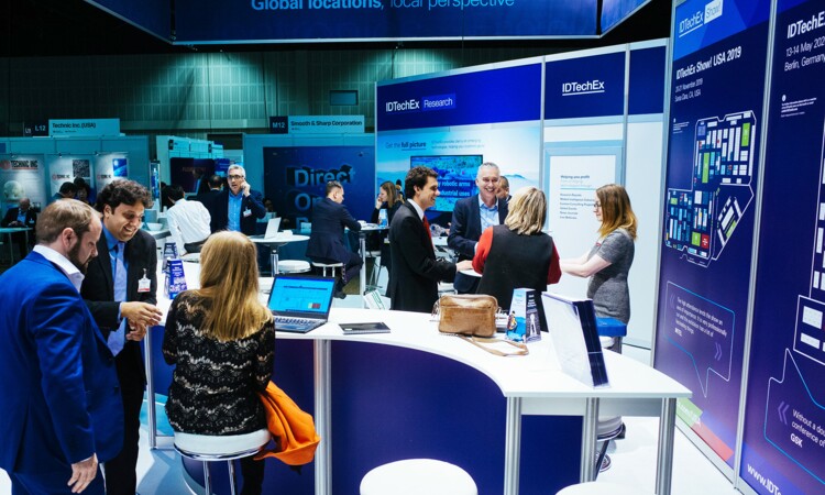 Exhibition stand with visitors in the convention hall II