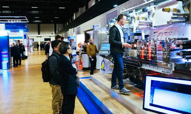 Exhibition stand with visitors in the convention hall II