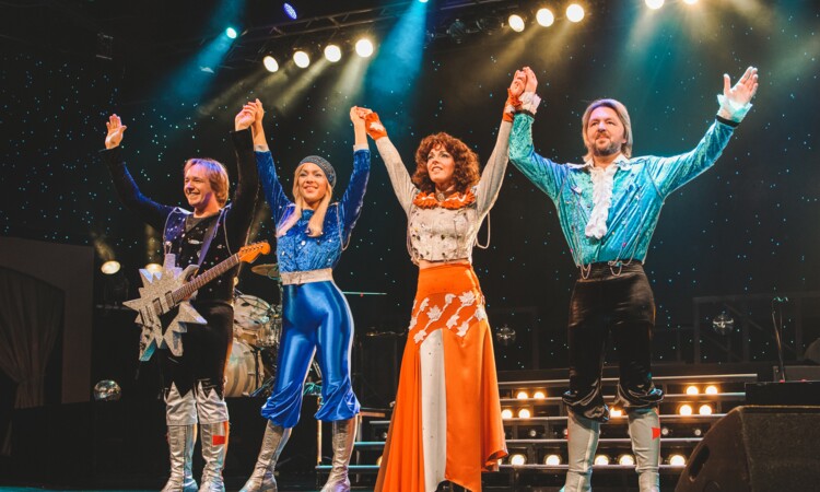 The impersonators of the ABBA-Show on stage of the Estrel Show Theatre