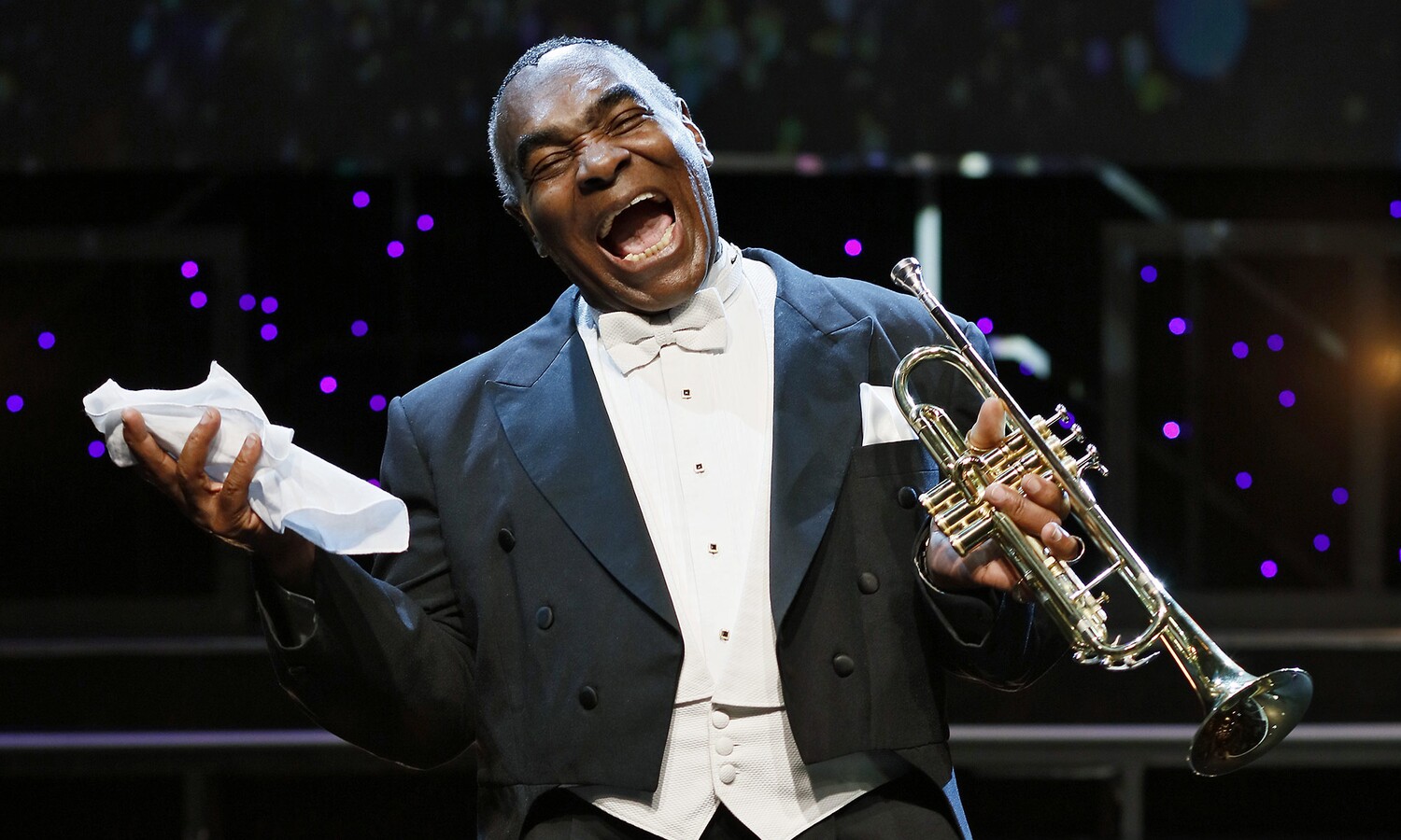 M.L. Jordan as Louis Armstrong