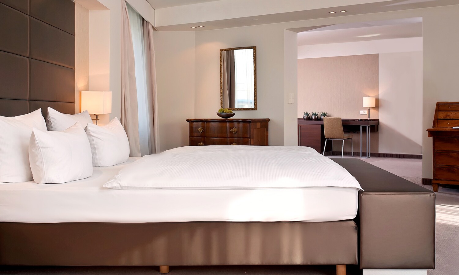 Double bed with antiques in a suite