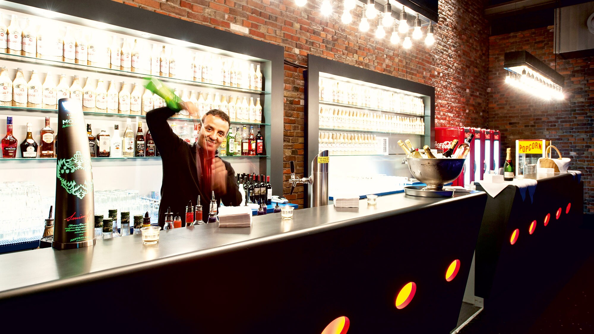 Barkeeper mixing drinks at Estrel Showtheater Berlin